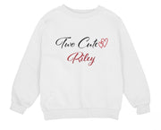 a young girl wearing a white sweatshirt with two cute hearts on it